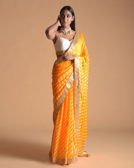 15. Simple Leheriya Saree  - Haldi Outfit Ideas